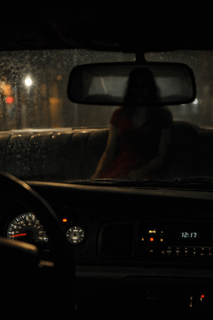A shadowy figure appears in the rearview mirror during the driver’s final last fare.